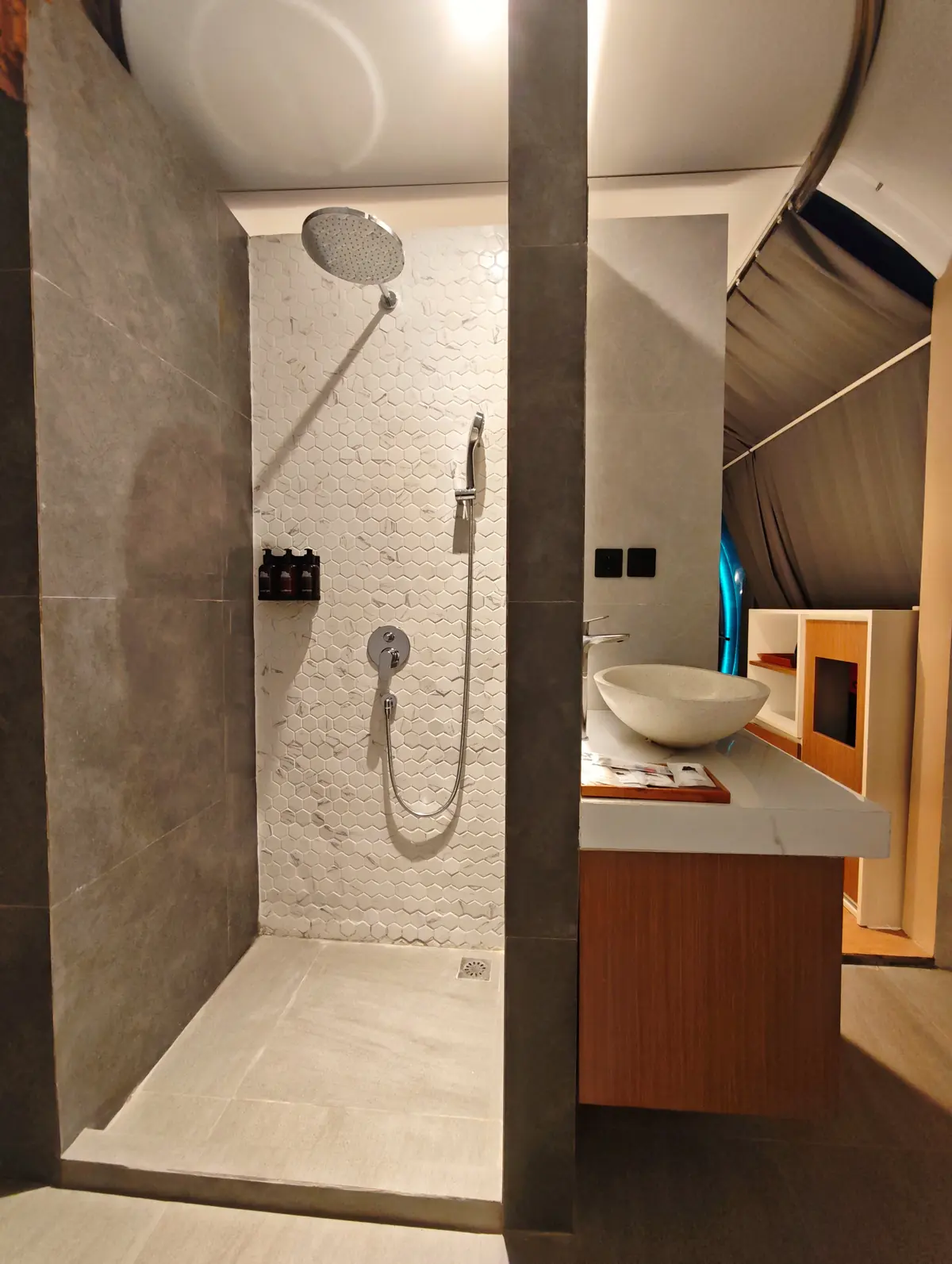 Bathroom shower and vanity inside Crystal Nest Suites in Kintamani.